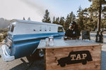 Big Bear custom mobile bar with rustic wooden bartop and baby blue vintage panel truck.
